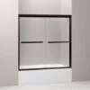 Kohler Gradient Sliding Bath Door, Crystal Clear Glass, Anodized Dark Bronze